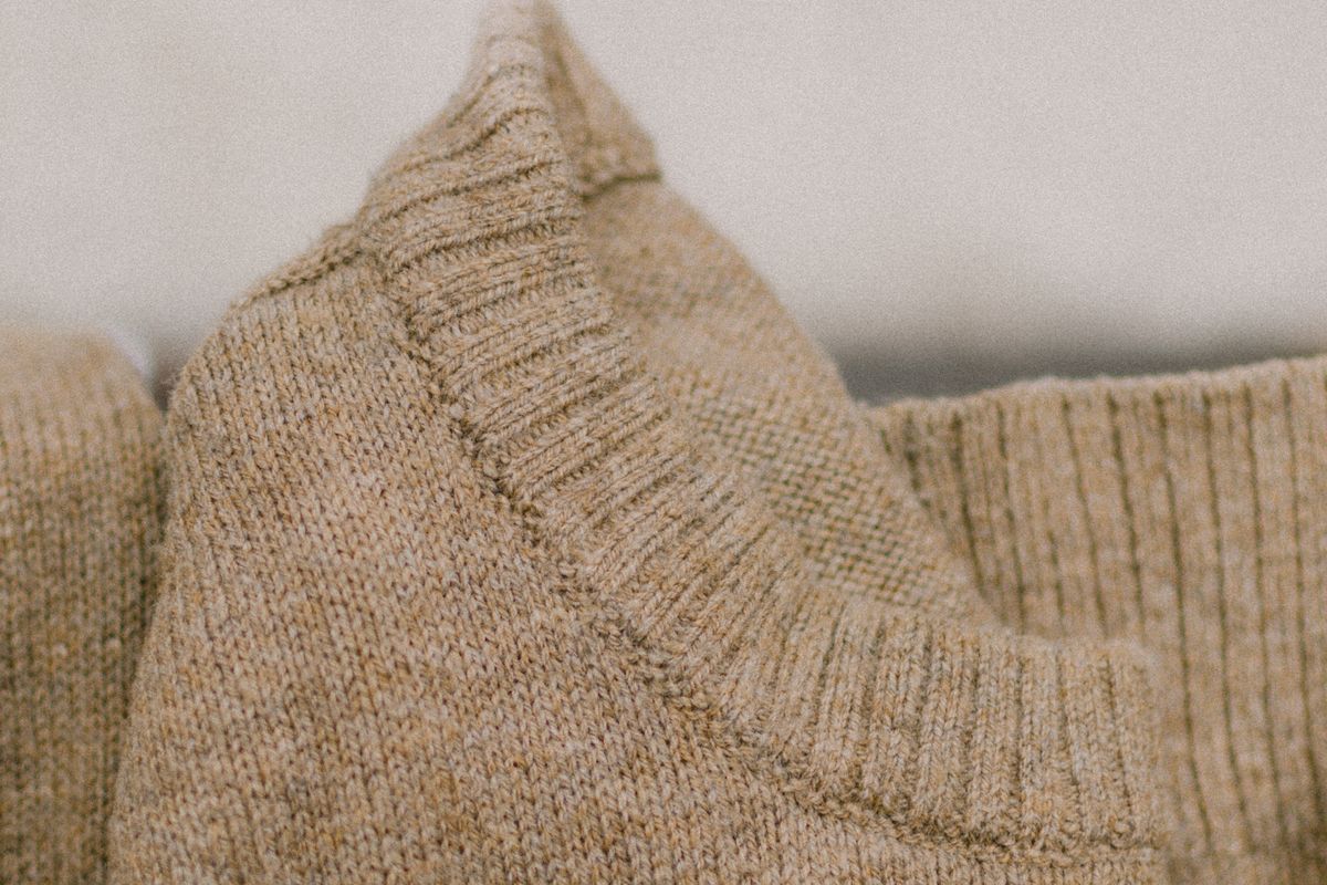 Close-up of the knit structure of a fine-gauge sweater