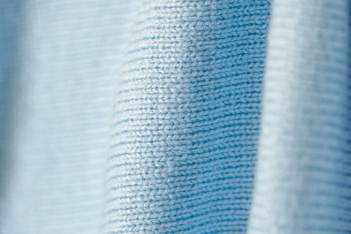 Macro view of the surface texture of a knitted cotton sweater
