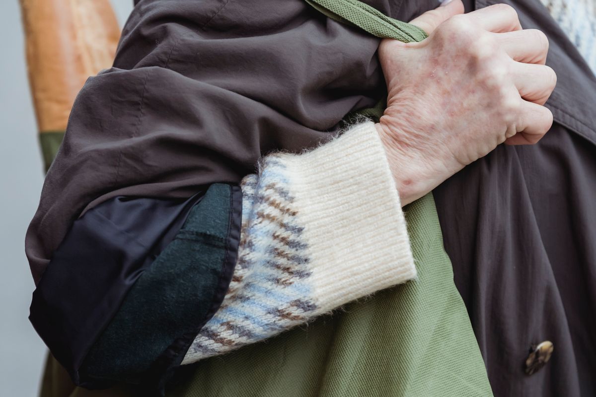 A woman carrying a bag on her shoulder